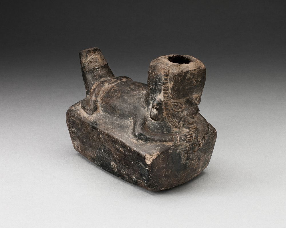 Vessel in the Form of a Flute-Player Laying atop Rectangle Shape by Chimú