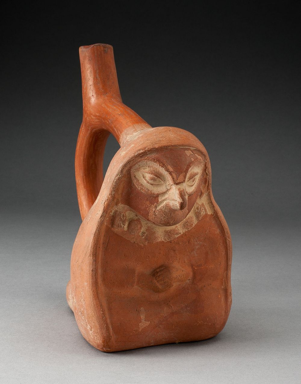 Handle Spout Vessel in the Form of a Seated Anthropomorphic Bird Wearing a Shawl by Moche