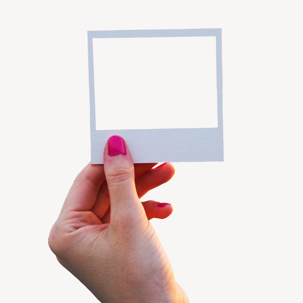Hand holding instant photo frame isolated image
