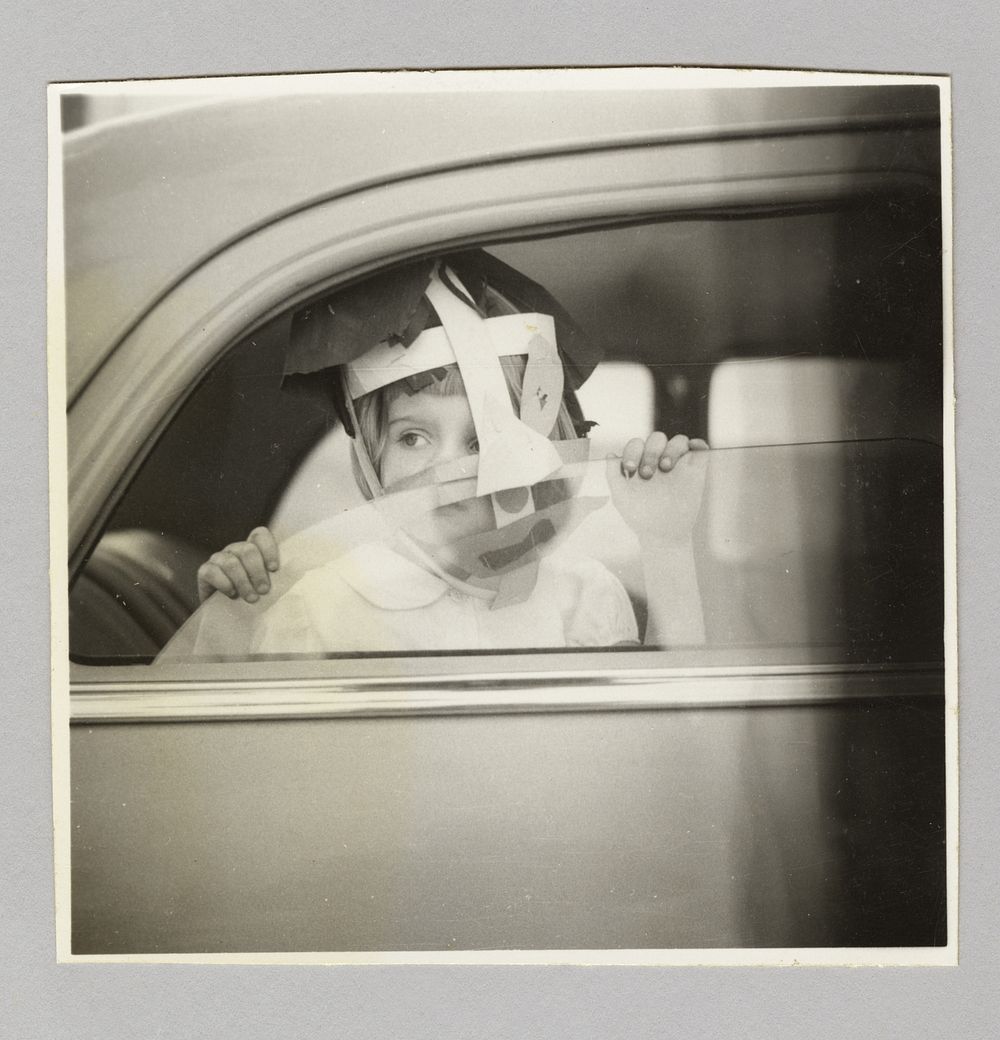 Untitled (boy in car window)