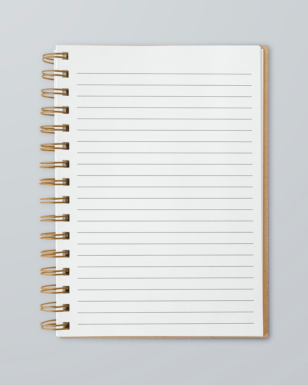 Blank ruled notebook mockup on a gray table