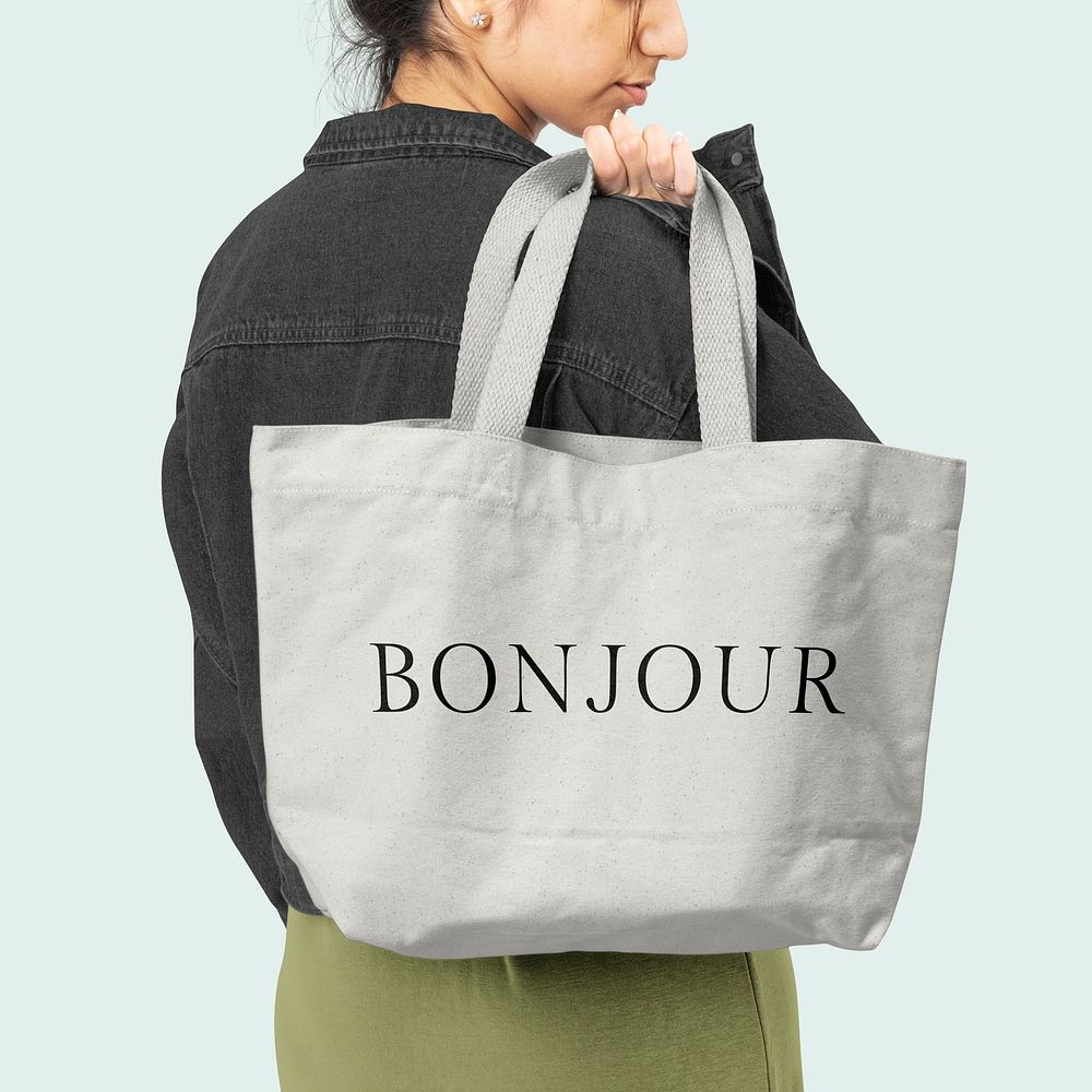 White tote bag psd mockup with Bonjour typography accessory studio shoot