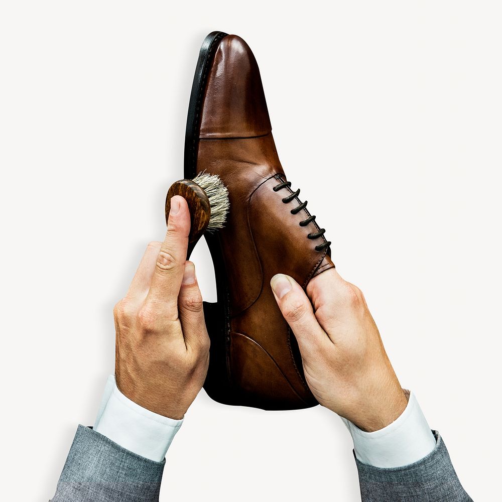Businessman cleaning shoes isolated image