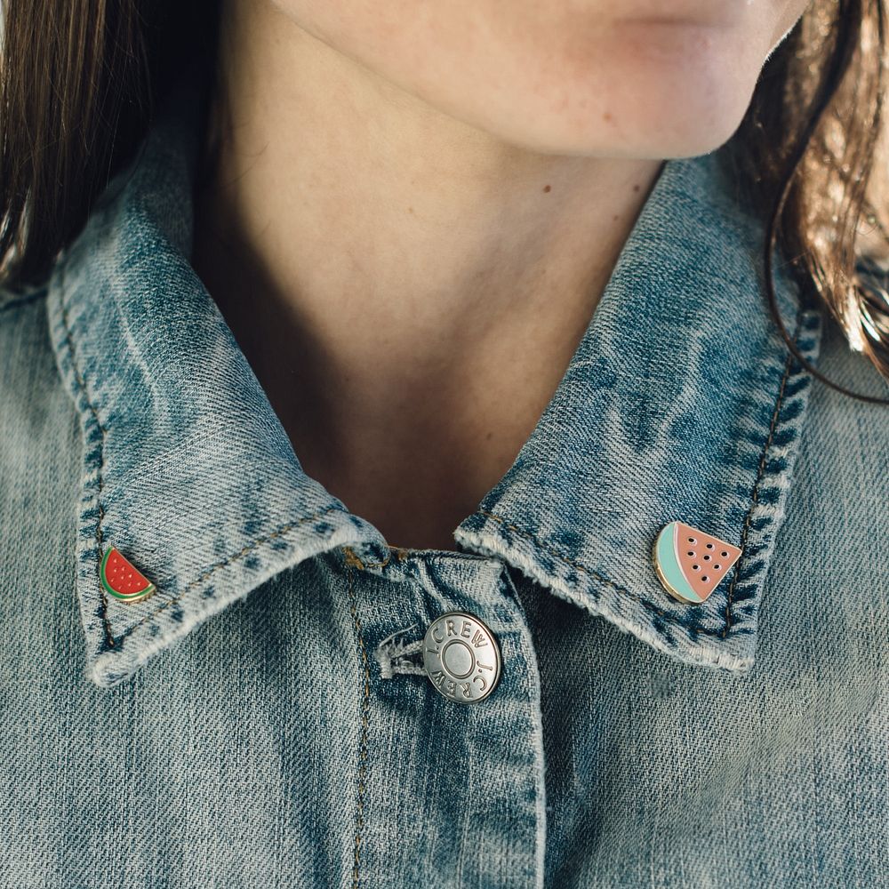 Watermelon fruit pins on a woman's jean jacket.