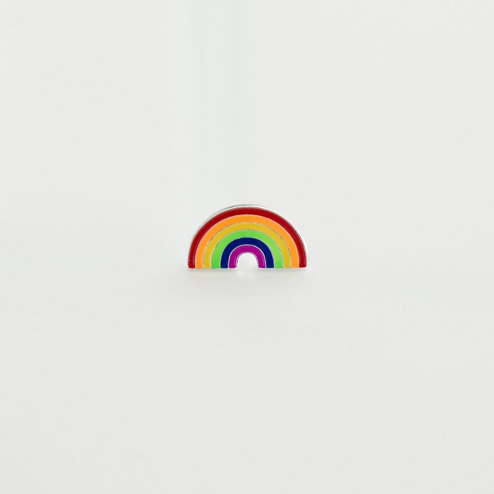 Rainbow lapel pin product photo.