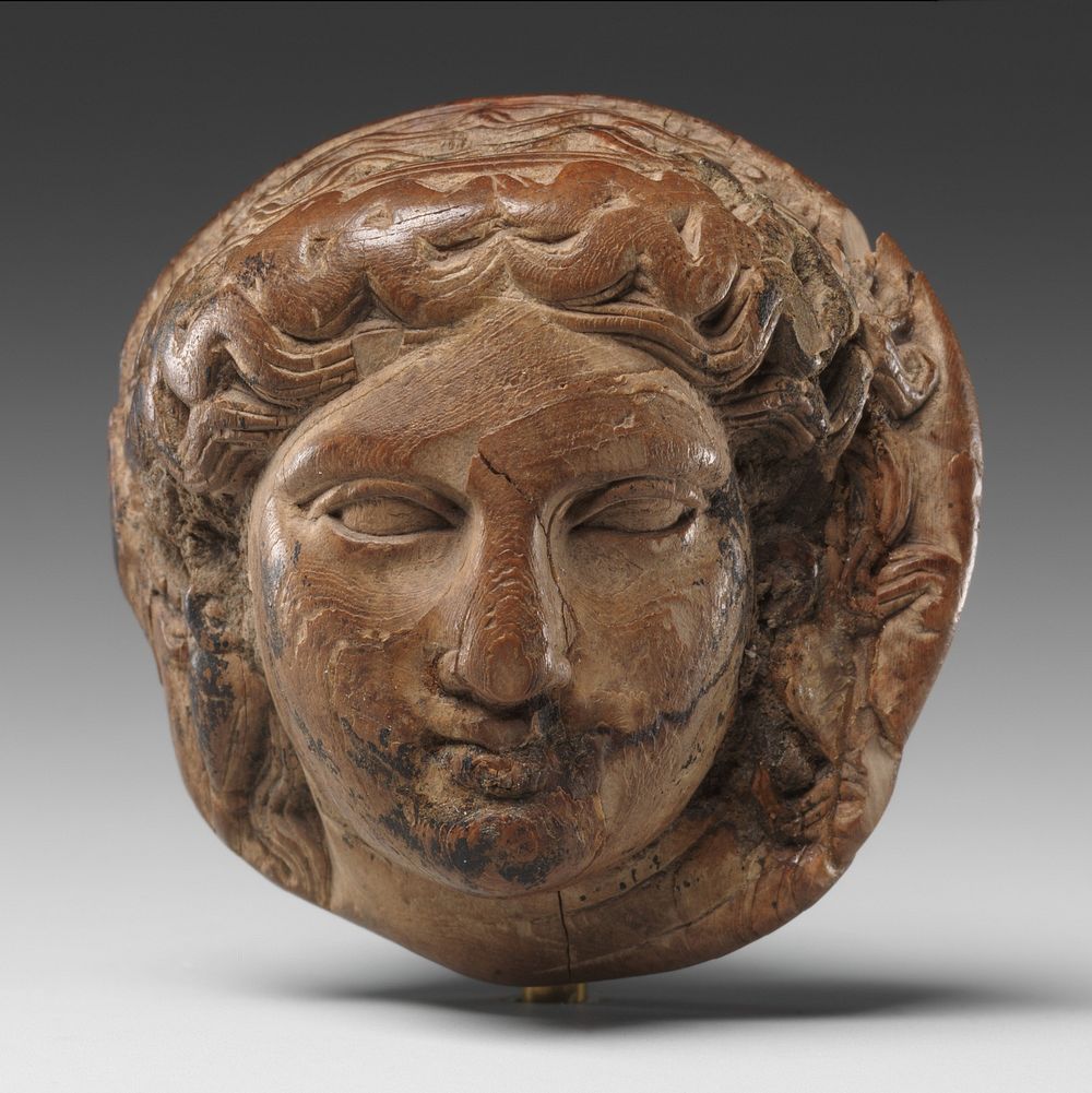 Head of Dionysus (?) for attachment, possibly for a couch