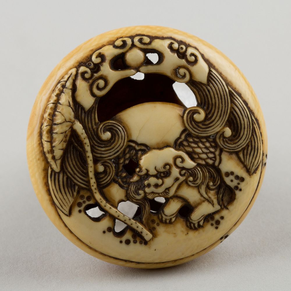 Netsuke Carved with Shishi; reverse with Lotus Leaf