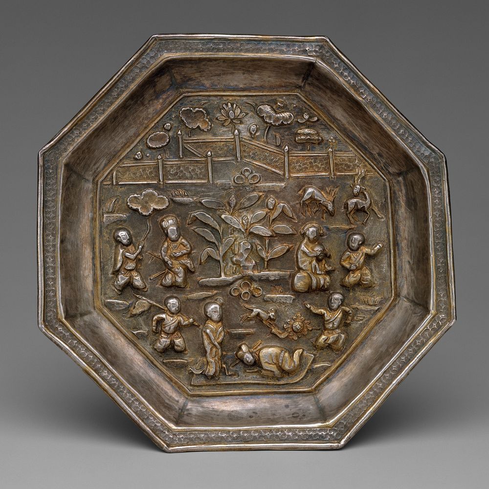 Dish with children playing in a garden
