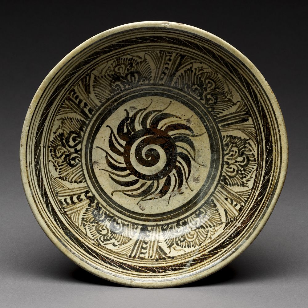 Bowl with flaming solar disk design