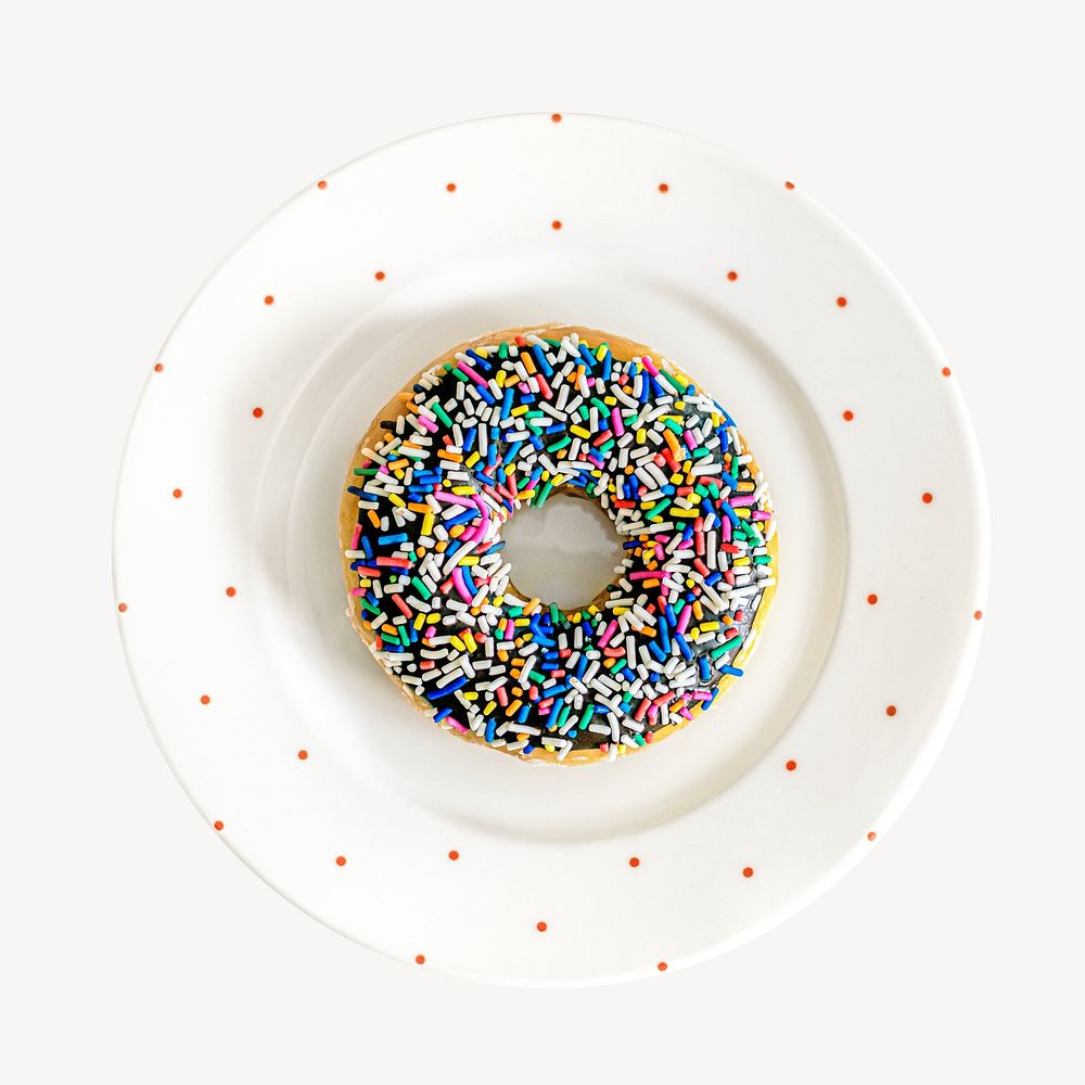 Colorful sprinkled donut, on a plate, aerial view