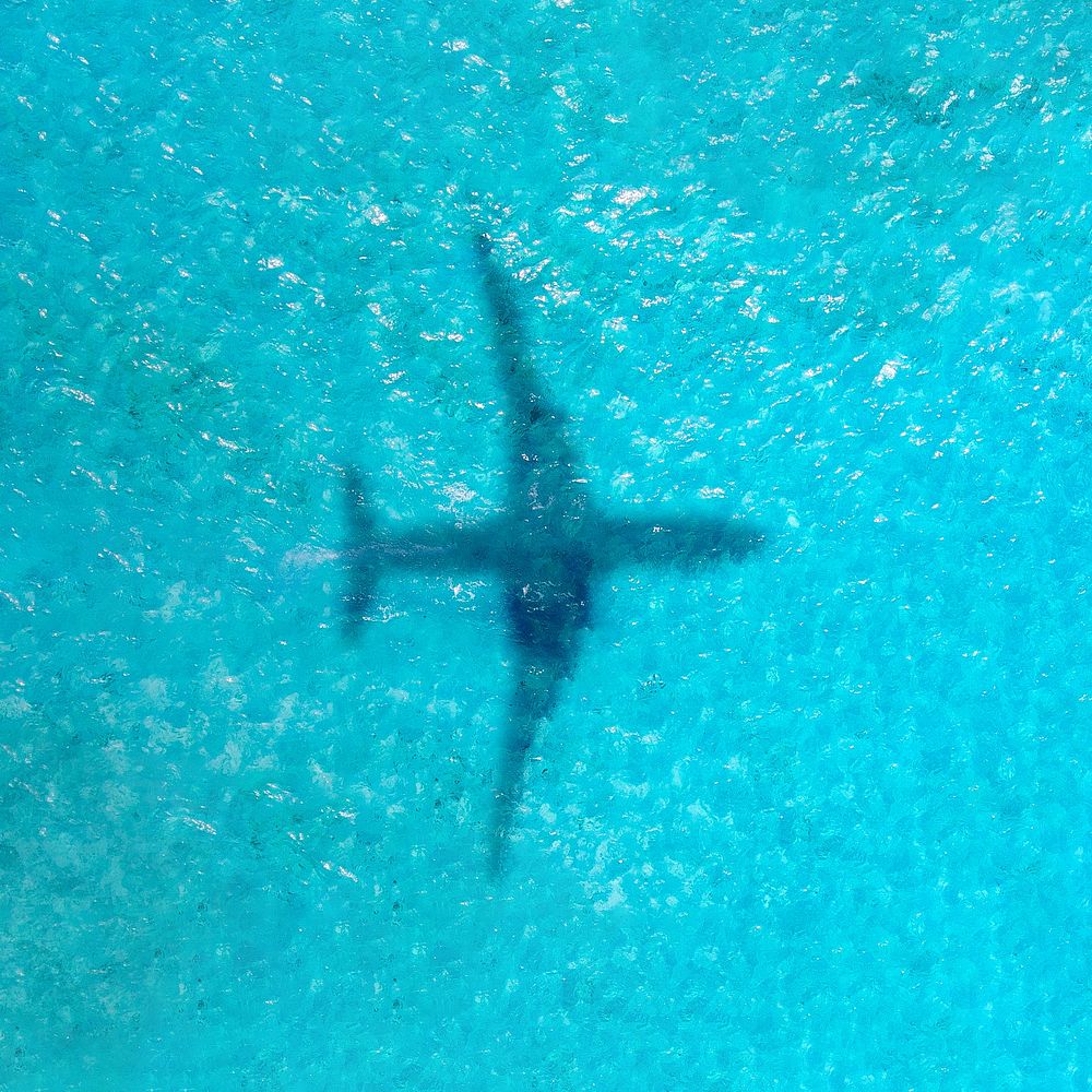 Plane shadow on ocean background