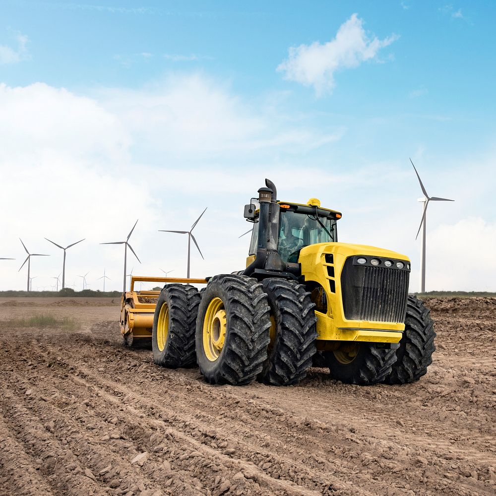 Tractor near wind farm