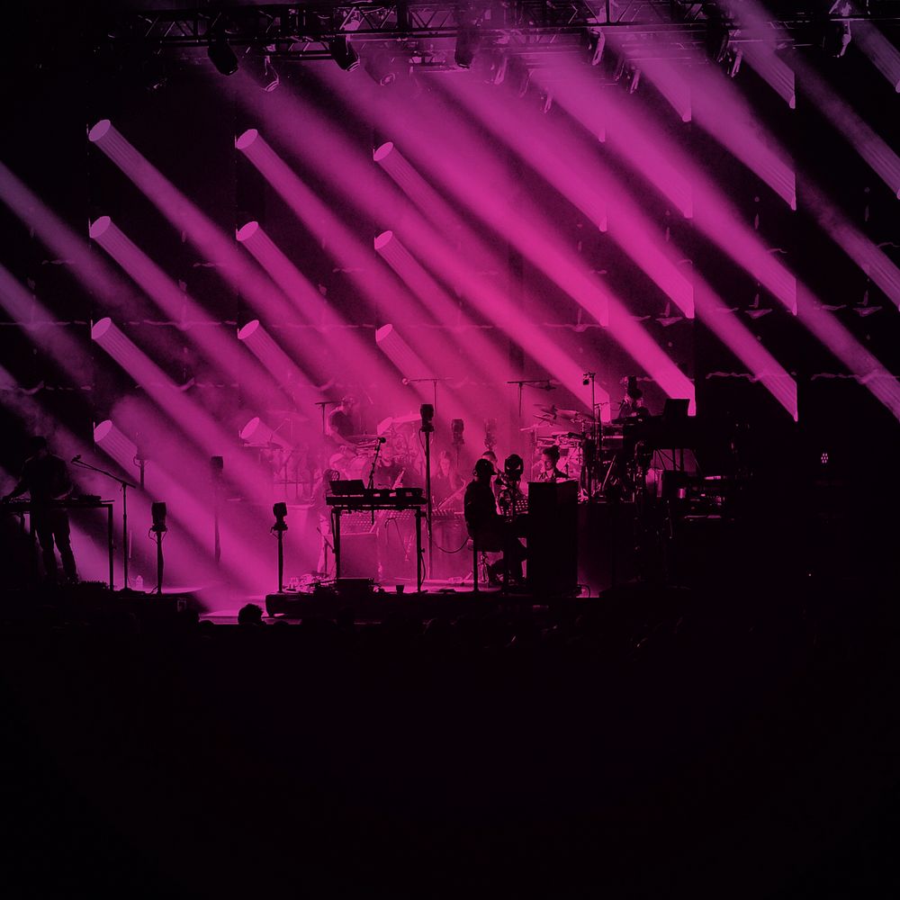 Silhouette concert, pink light background