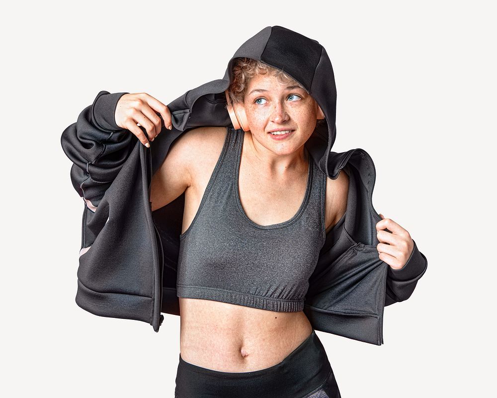 Girl in sports bra jacket listening to music image element.