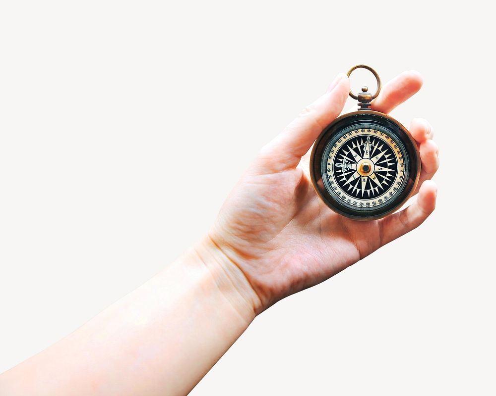 Hand holding compass on white background