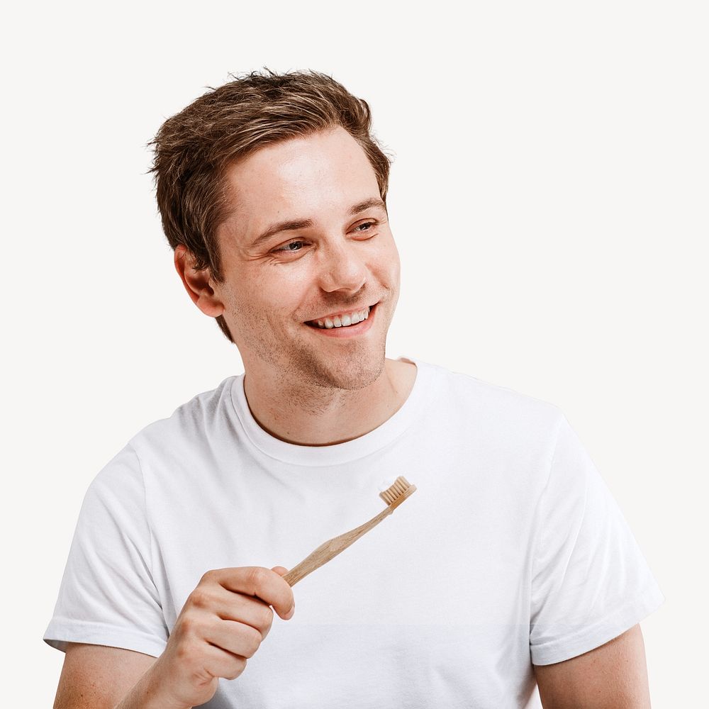 Man holding a wooden toothbrush isolated image
