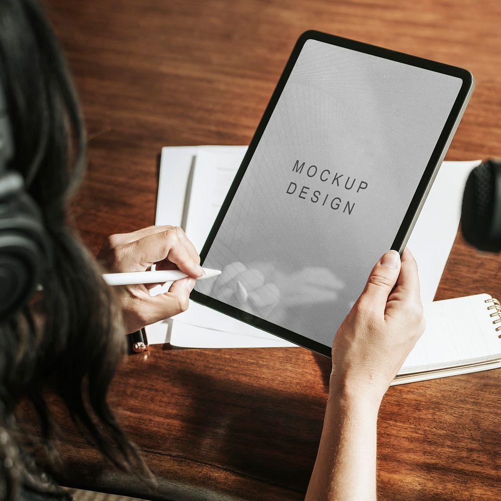 Woman writing on a digital tablet mockup mobile phone wallpaper