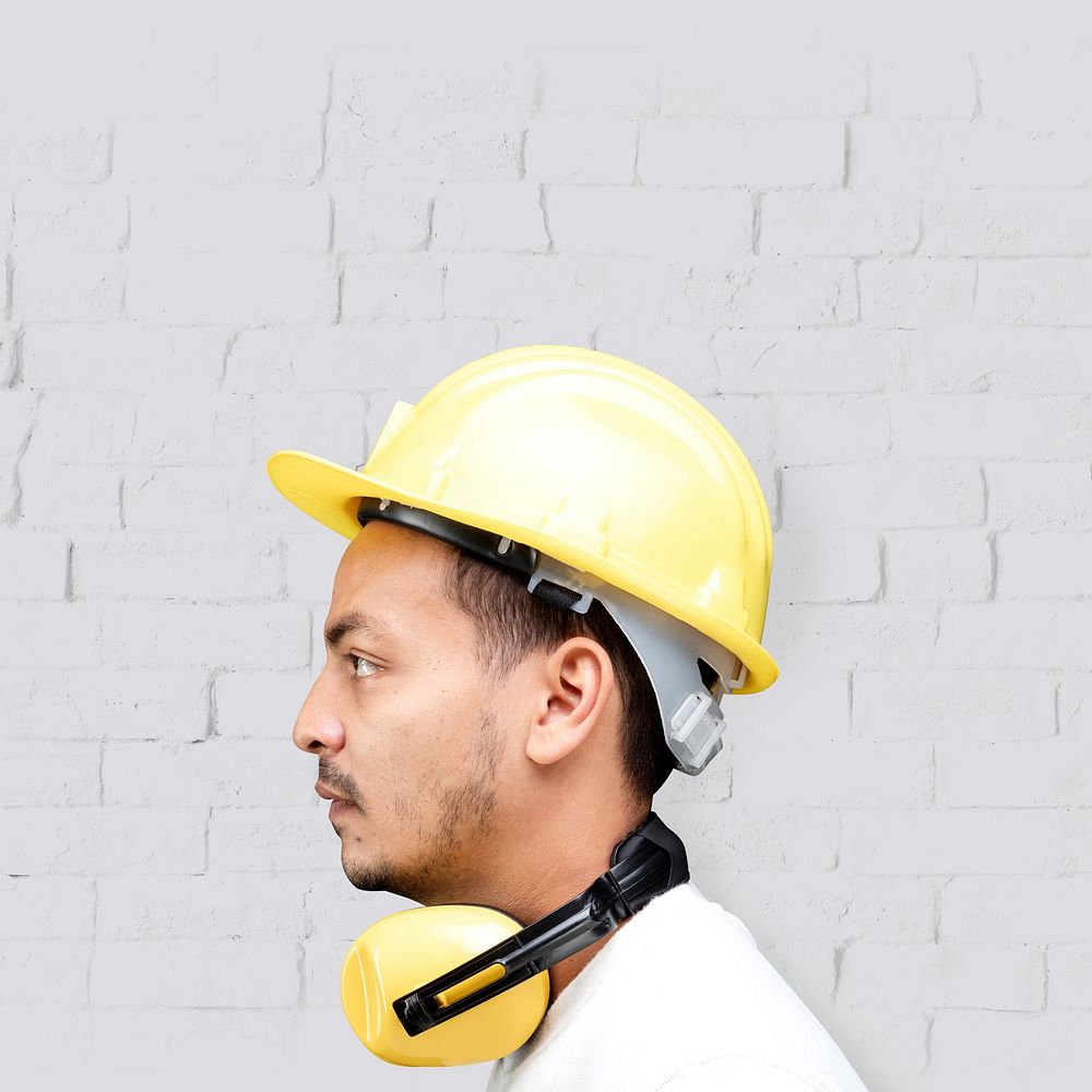 Man with safety helmet, yellow PPE