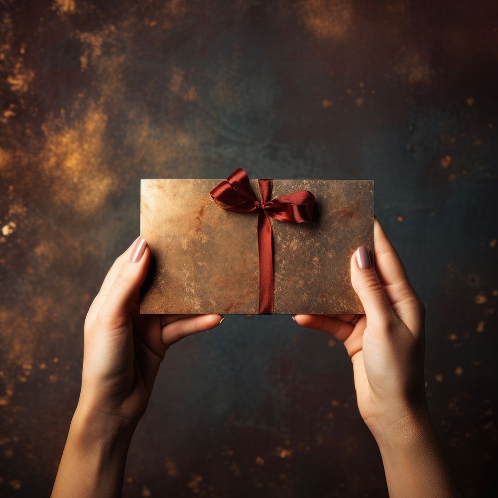 Holding paper gift hand. AI generated Image by rawpixel.