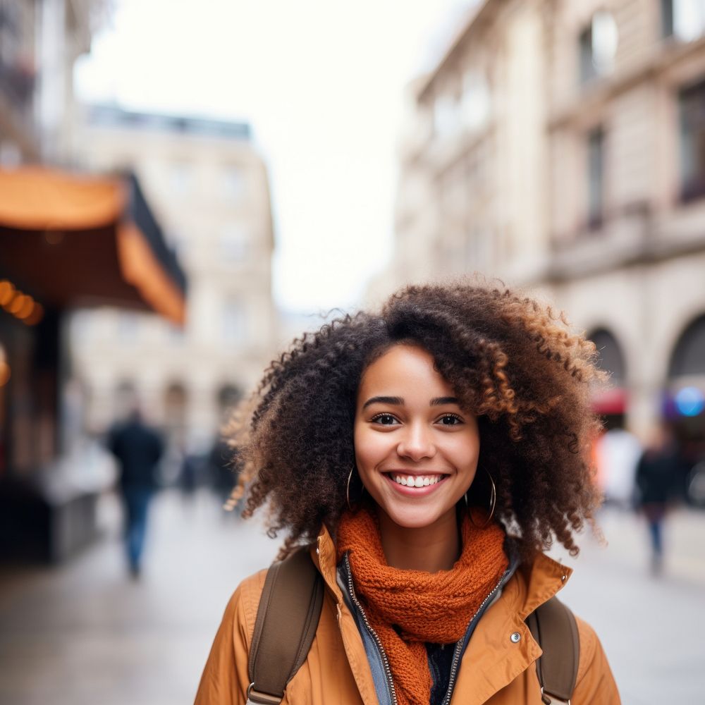 Happy black woman in city