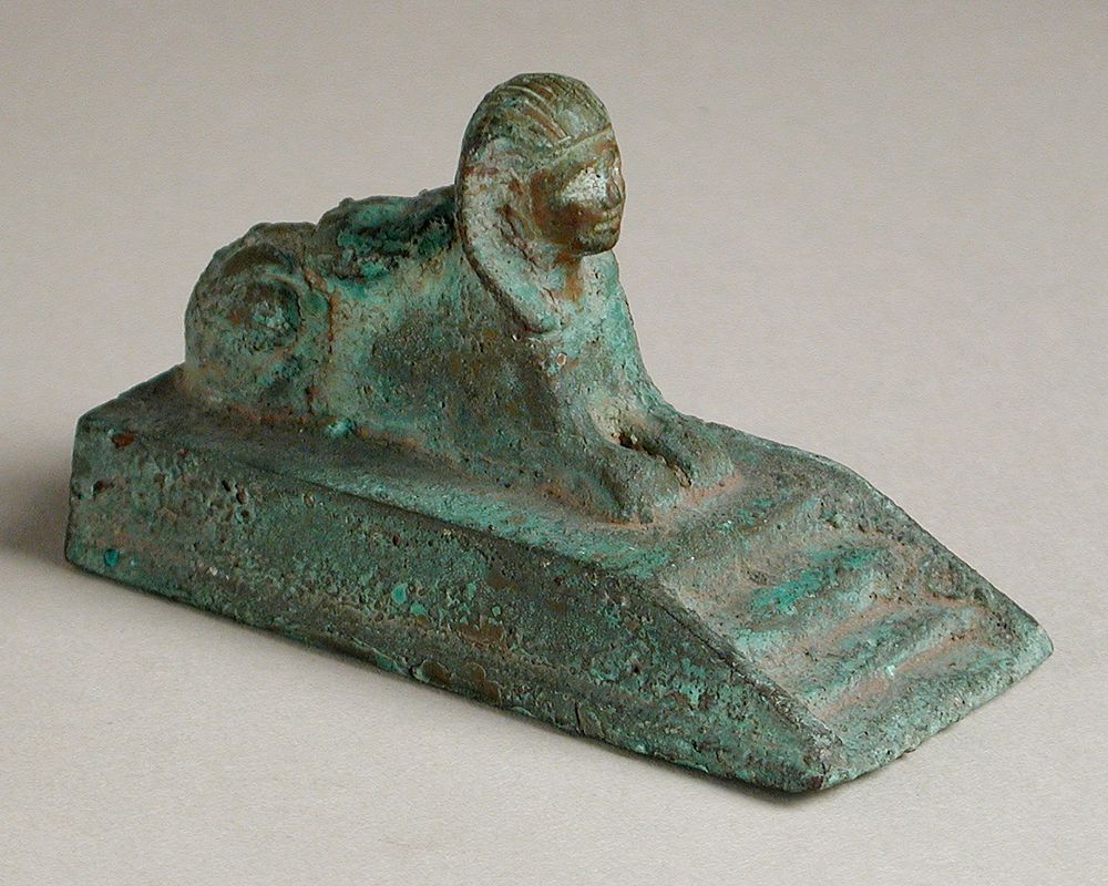 Recumbent Sphinx Figurine on a Stepped Platform
