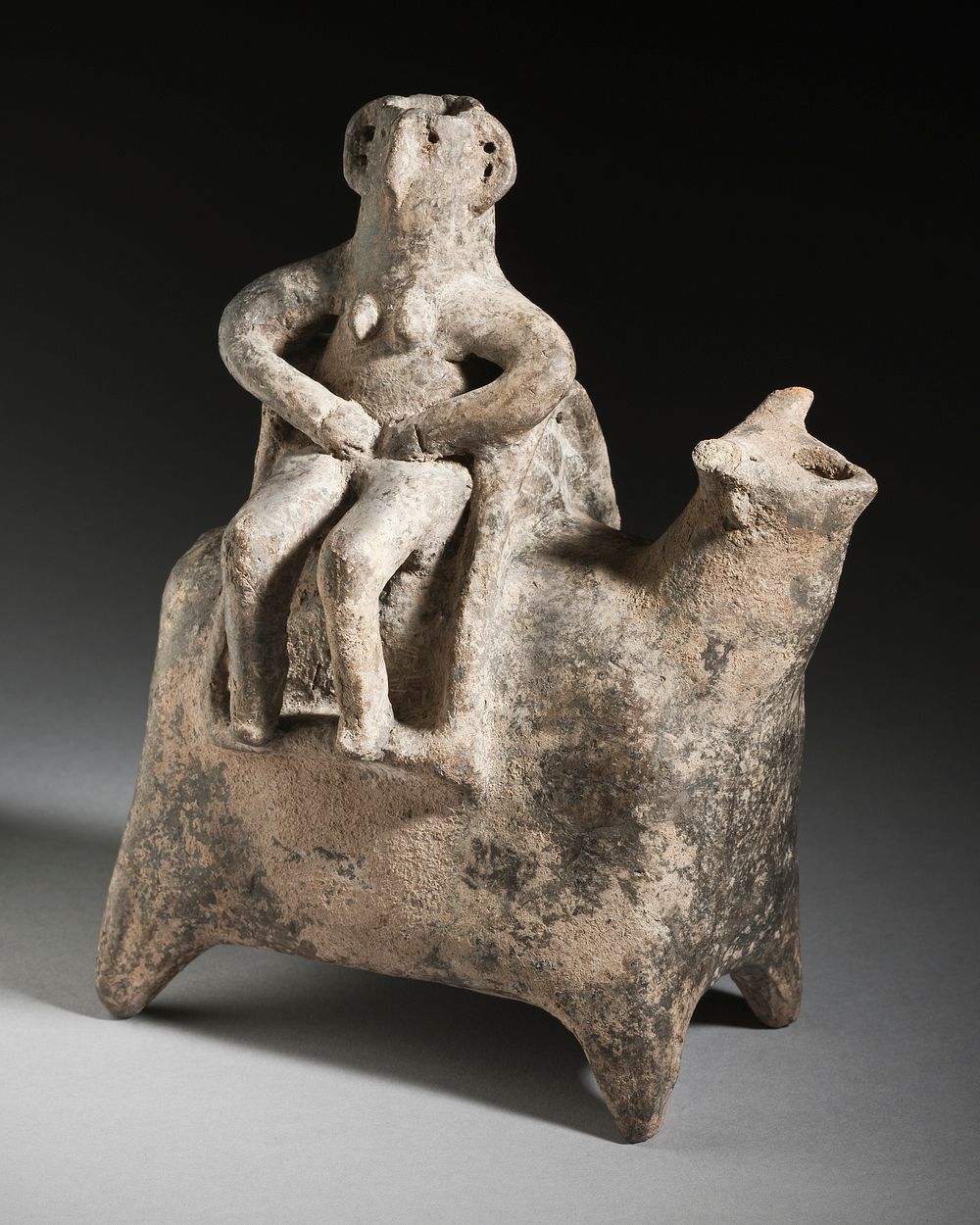 Woman Sitting on an Ox