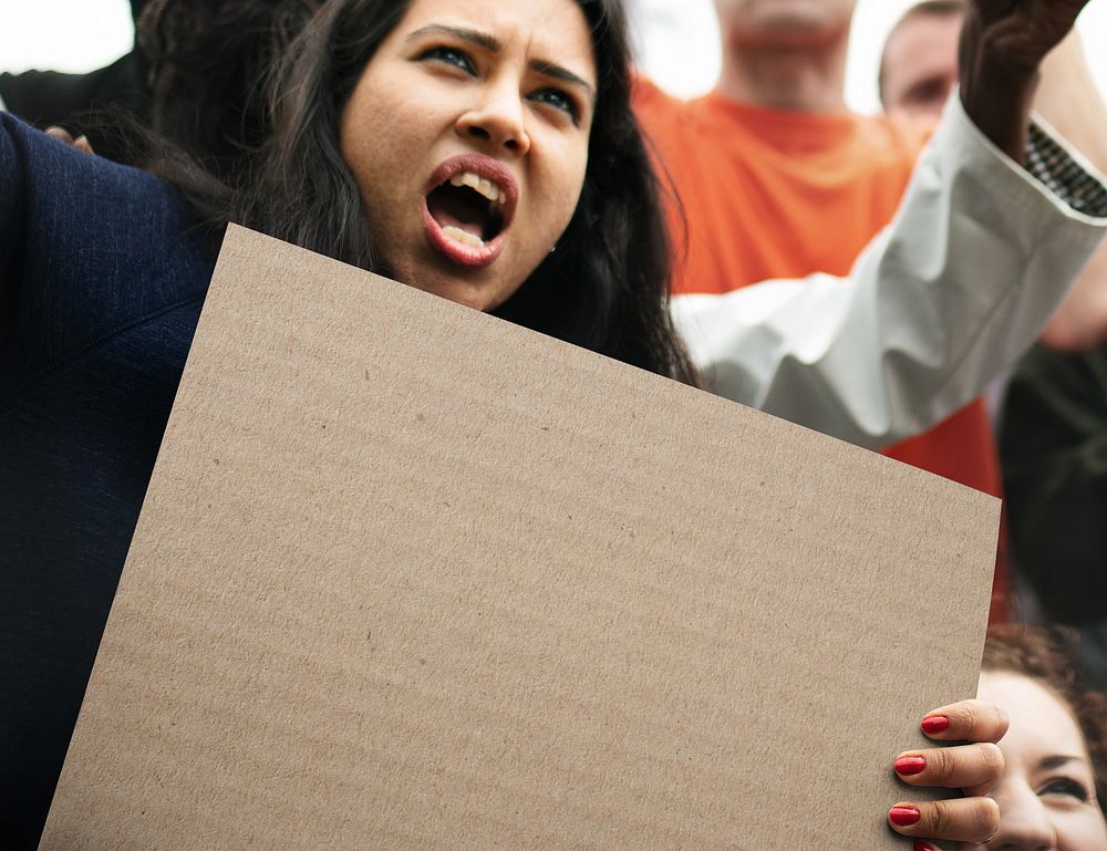 Protesting woman holding blank sign