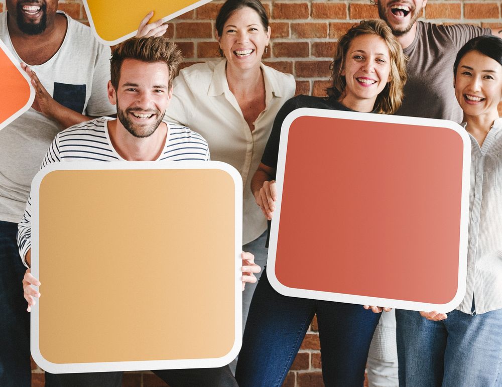 Diverse people holding blank signs