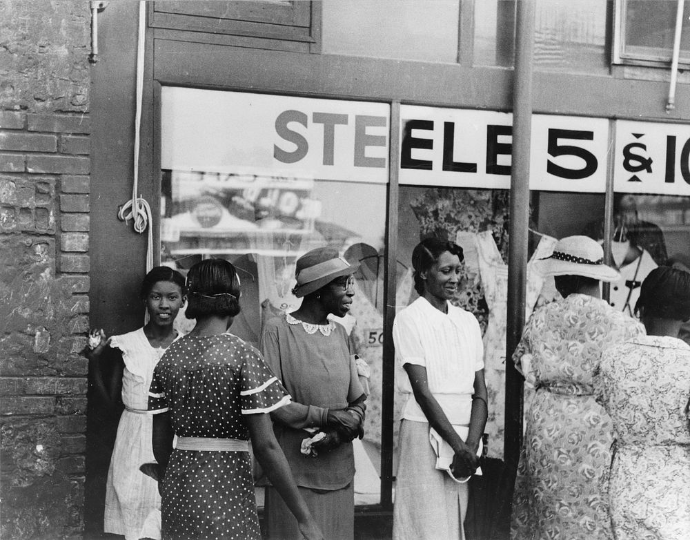 Women in front of ten cent store, Steele, Missouri by Russell Lee
