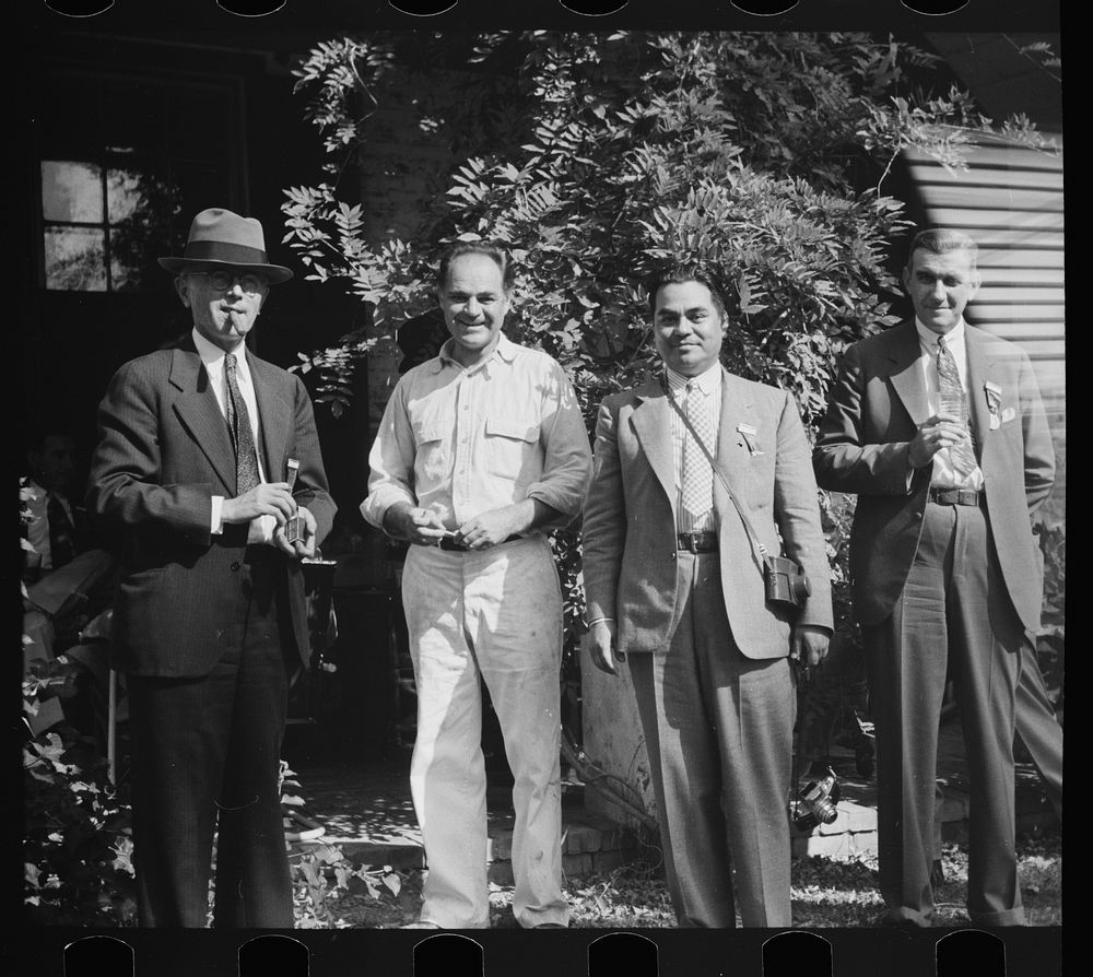 Allen Ramsey Wurtele, second from left, inventor of mechanical sugarcane harvester with sugarcane experts who came up from…