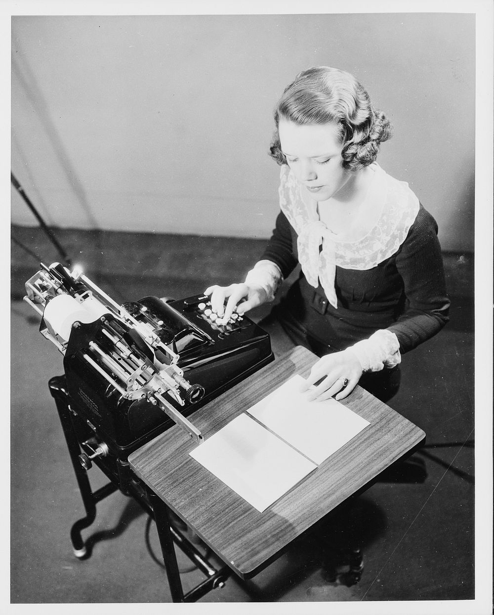 Girl using adding machine. Sourced from the Library of Congress.