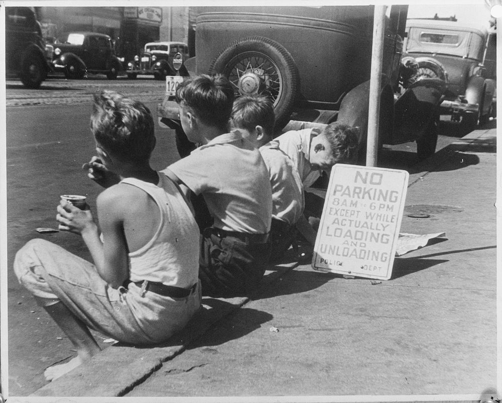 Boys sitting on curb. Washington, D.C.. Sourced from the Library of Congress.