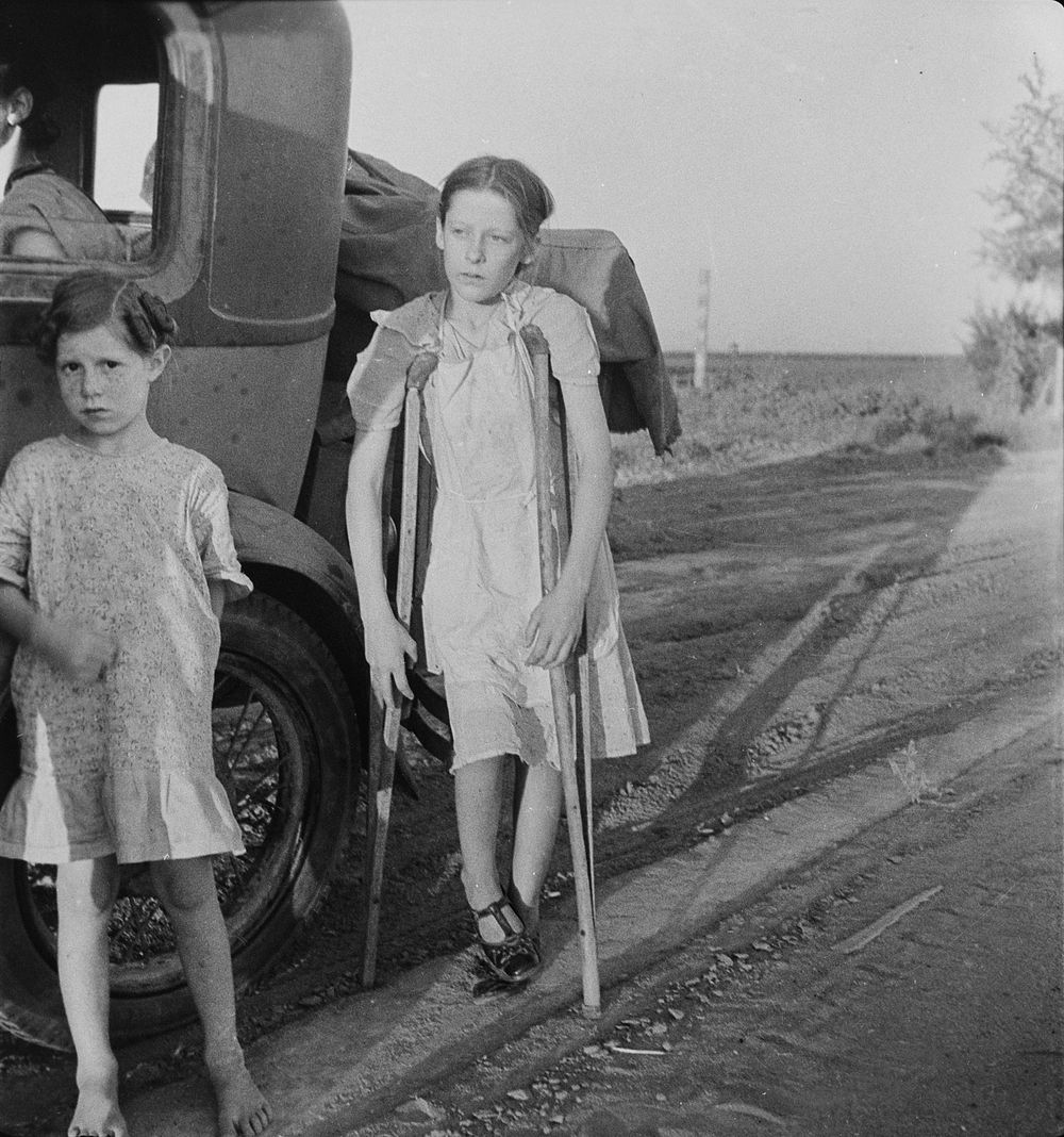 Children of Oklahoma drought refugees on highway near Bakersfield, California. Family of six; no shelter, no food, no money…