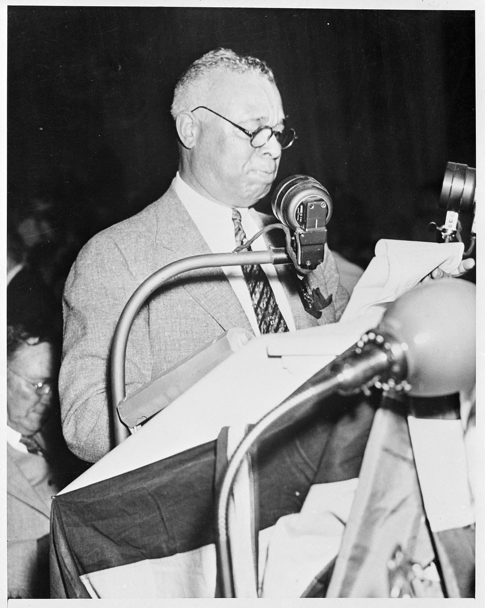 [Untitled photo shows: Representative Arthur W. Mitchell, of Chicago, snapped as he spoke at the Democratic National…