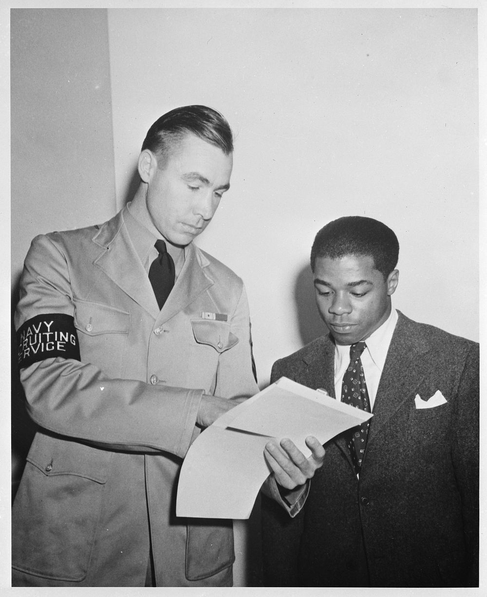 [Untitled photo shows: William Baldwin, June 1942. Baldwin was the first U.S. Navy African American recruit being assisted…