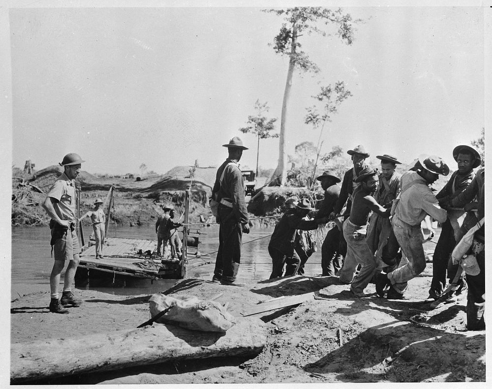 [Untitled photo shows: Engineers constructing a temporary bridge in New Guinea]. Sourced from the Library of Congress.