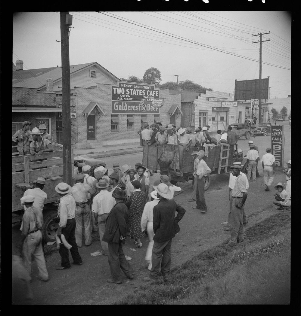 Truck loads of cotton hoers going from Memphis, Tennessee into Arkansas. Sourced from the Library of Congress.