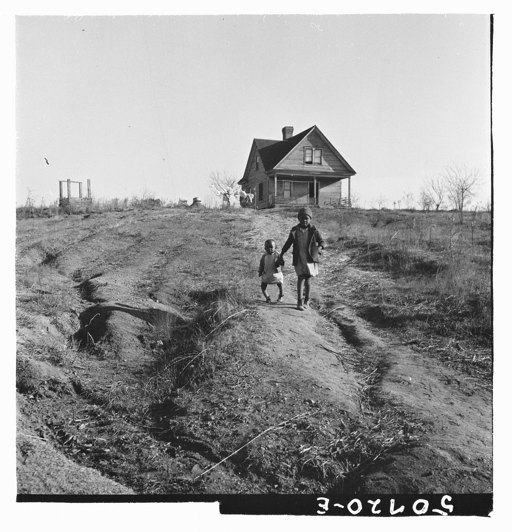 children and old home on badly eroded land near Wadesboro, North Carolina. Sourced from the Library of Congress.