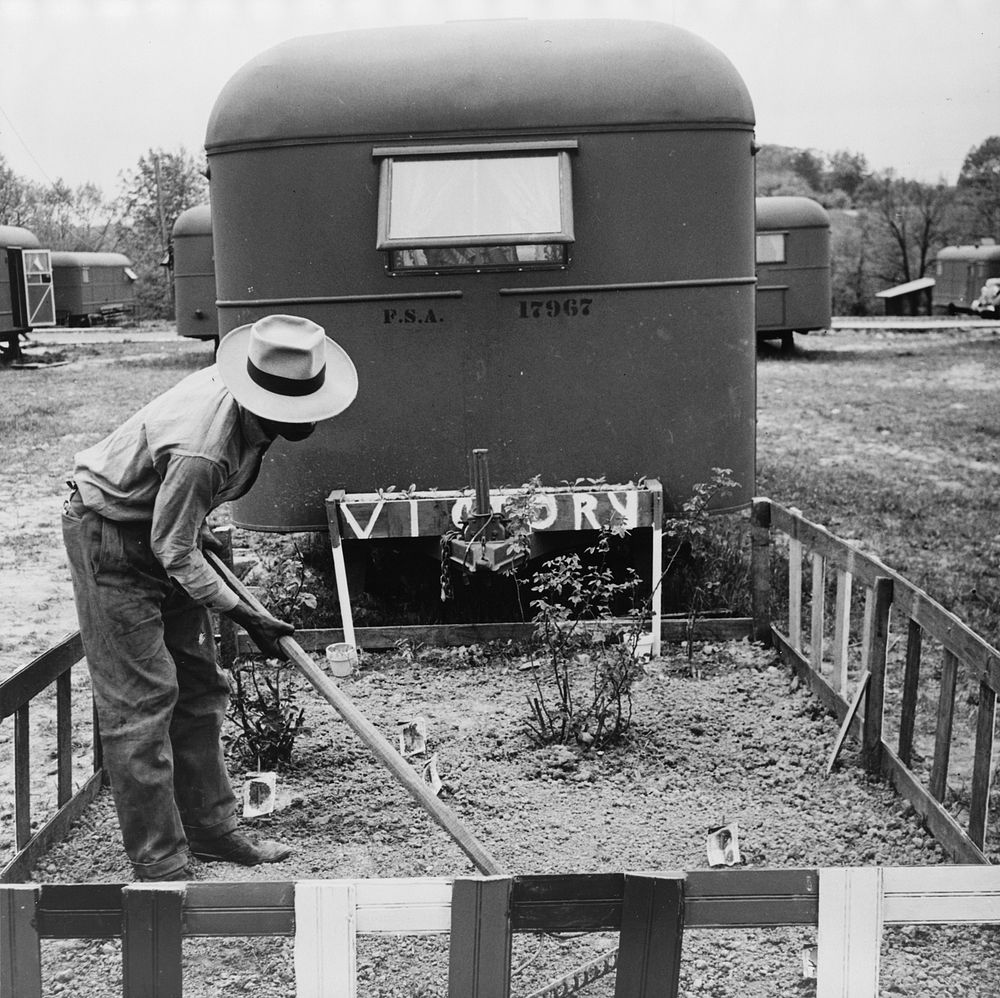 Arlington, Virginia. FSA (Farm Security Administration) trailer camp project for es. Project occupant tending his victory…