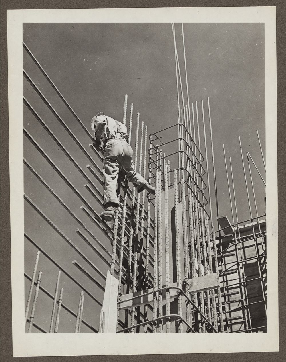 Grand Coulee Dam, Columbia Basin Reclamation Project, Wash. A steel worker working on a section of the Grand Coulee dam east…