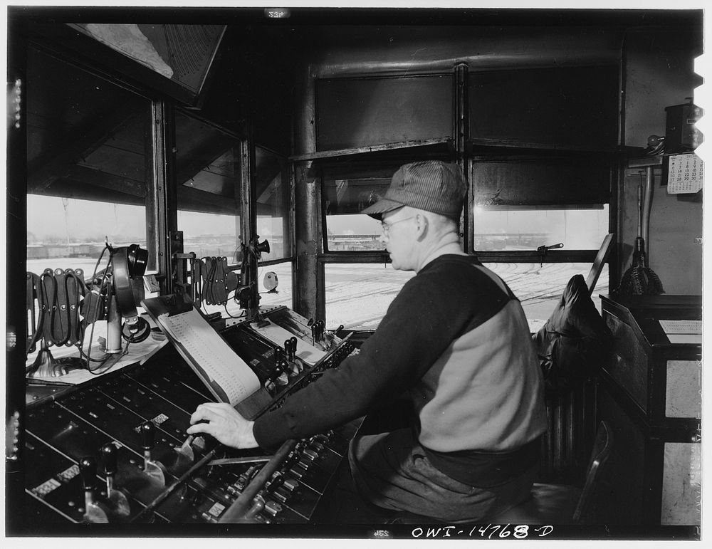 Chicago, Illinois. Retarder operator in his tower at the hump in the Chicago and Northwestern classification yard. Sourced…