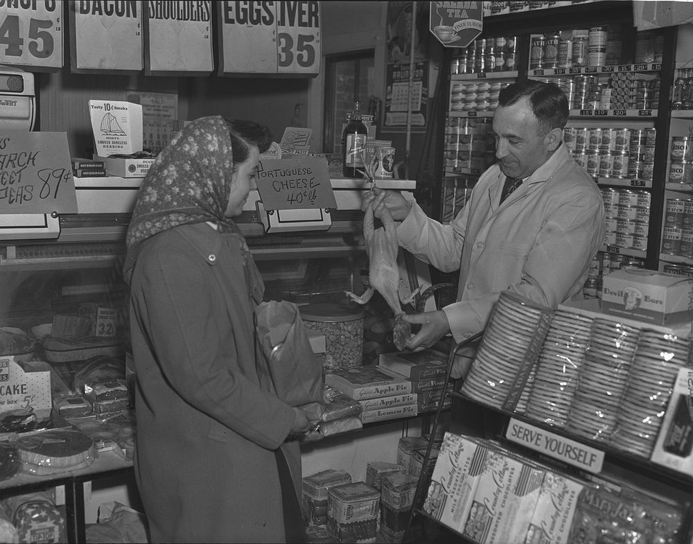 Provincetown, Massachusetts. Mrs. John Russe shopping in a Portuguese store. Sourced from the Library of Congress.