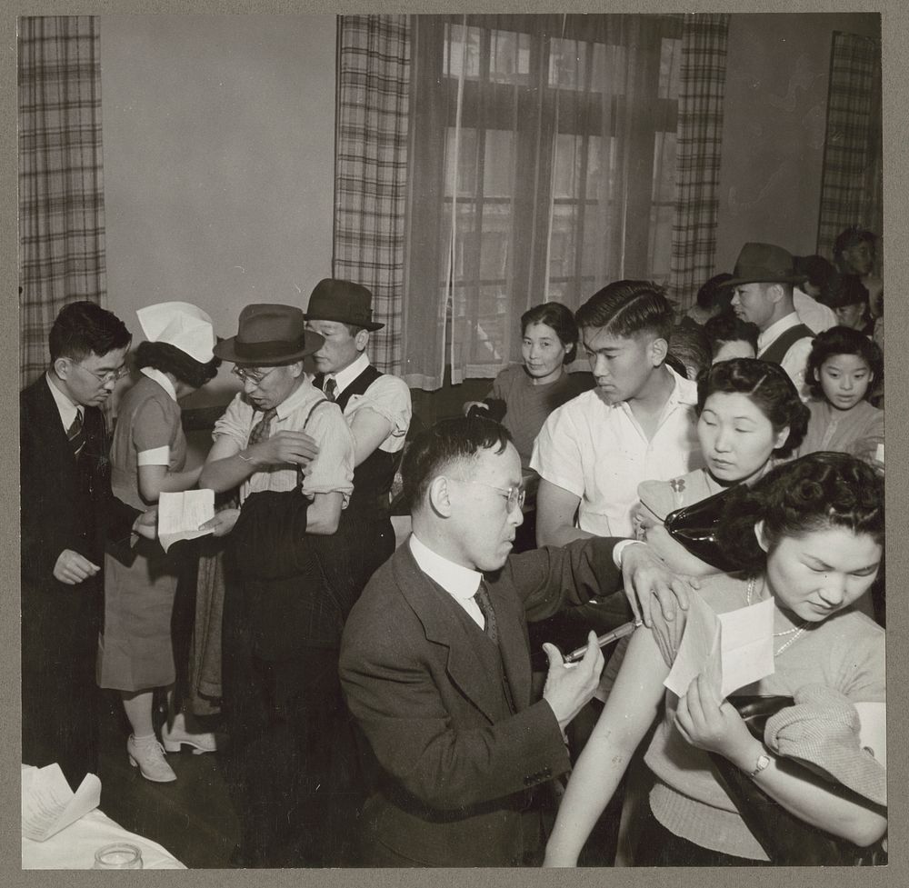 San Francisco, Calif. Apr. 1942. Evacuees of Japanese descent being inoculated as they register for evacuation. They will be…