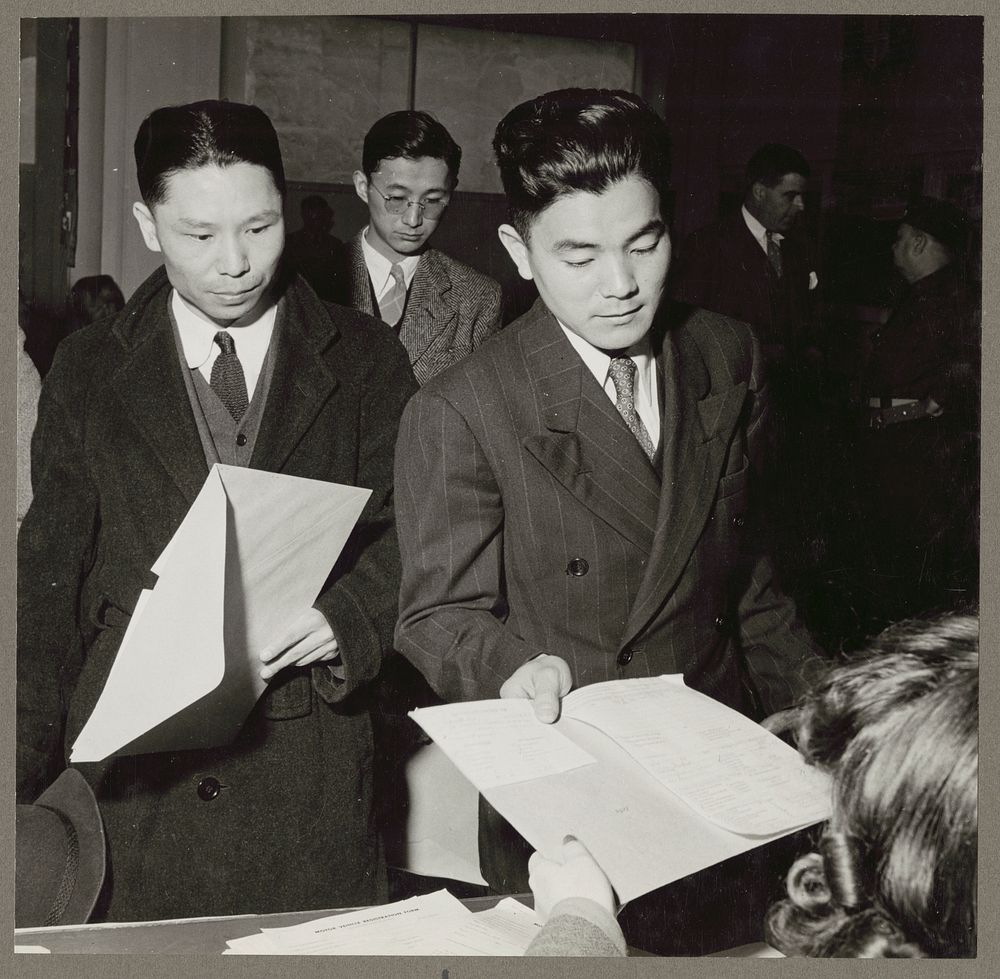 San Francisco, Calif. Apr. 1942. Residents of Japanese ancestry filing forms containing personal data at the Wartime Civil…