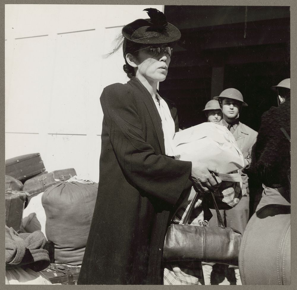 San Francisco, Calif. Apr. 1942. An early comer arriving at the station from which a contingent of 664 residents of Japanese…