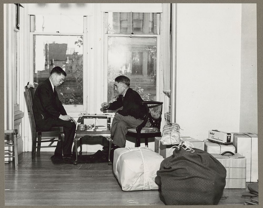 San Francisco, Calif. Apr. 1942. Two friends, of Japanese descent, playing a final game of checkers (?) while awaiting…
