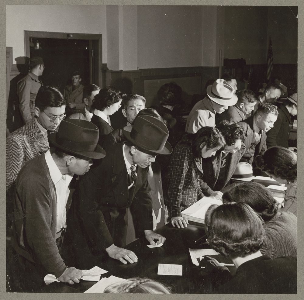 San Francisco, Calif. Apr. 1942. Residents of Japanese ancestry obtaining information on evacuation. Evacuees will be housed…
