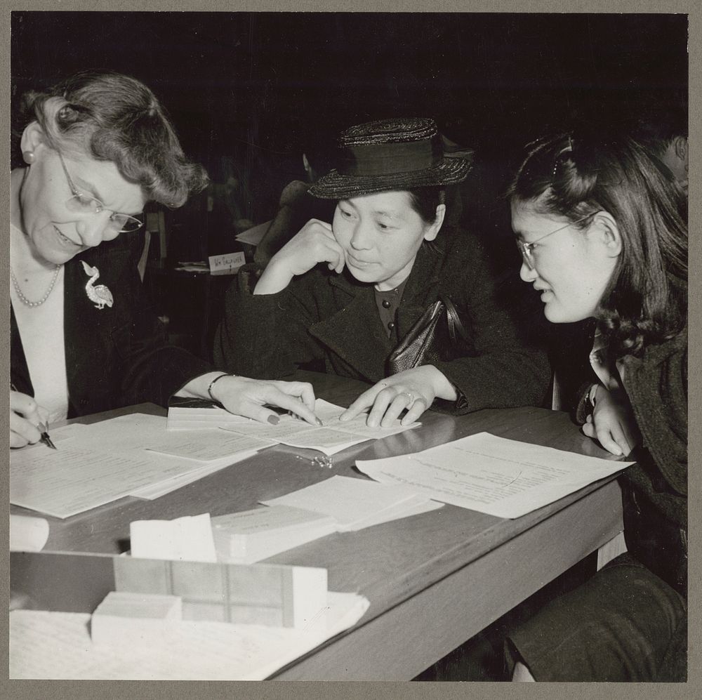 San Francisco, Calif. Apr. 1942. Two evacuees of Japanese ancestry in a conference with a Relocation authority, on…
