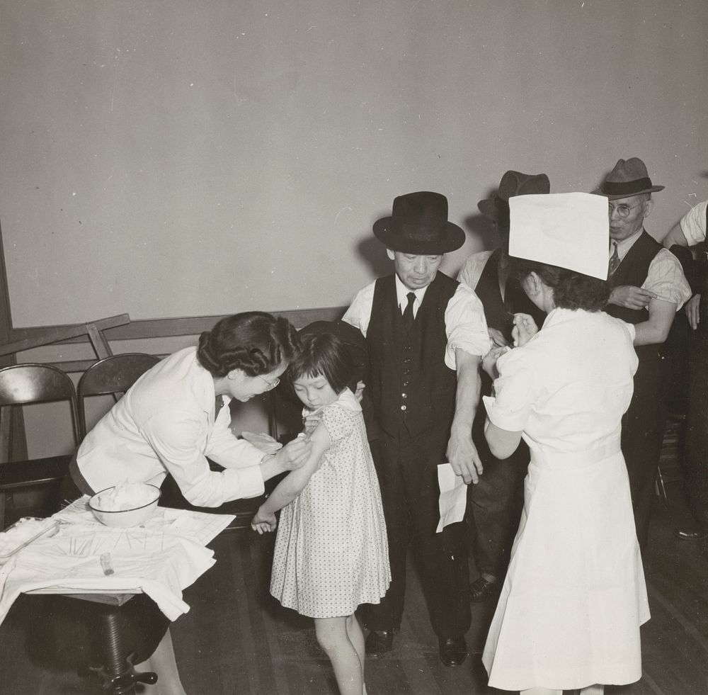 San Francisco, Calif. Apr. 1942. Evacuees of Japanese descent inoculated as they registered for evacuation and assignment…