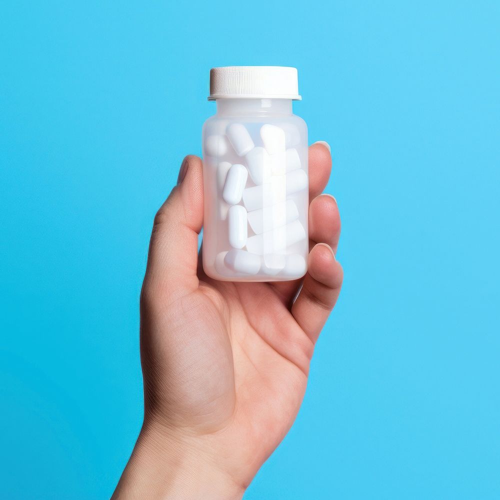 Pill holding bottle hand. AI generated Image by rawpixel.